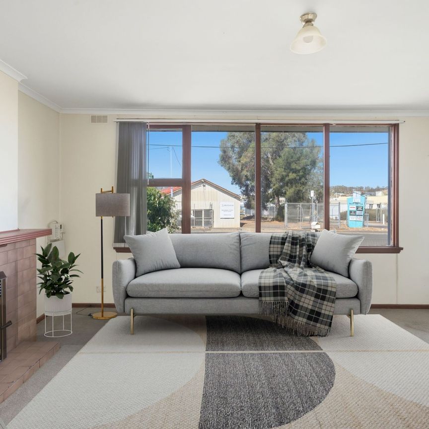 Neat & Practical Home with Secure Parking - Photo 1