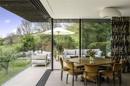 An exceptional contemporary home with quality interiors and landscaped gardens in an elevated position with village and open country views. - Photo 3