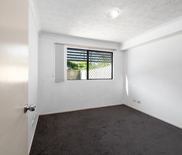 Charming Two-Bedroom Unit with Generous Private Courtyard in Secure... - Photo 2