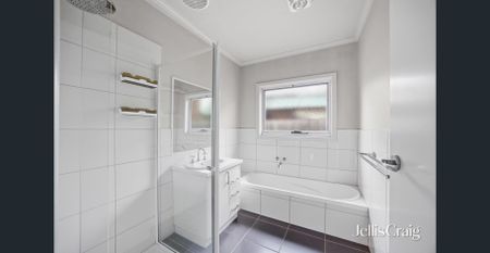 Quality Three-Bedroom Home with Exceptional Garage Space - Photo 5