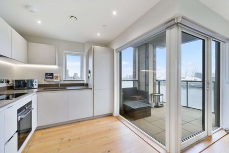 Spanning approximately 561sq ft (including winter garden), the apartment features a bright and spacious open-plan reception, dining, and kitchen area, finished with sleek modern fittings. - Photo 3