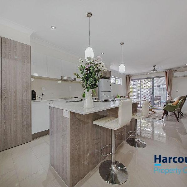 Gorgeous Three Bedroom Townhouse in Prime Location - Photo 1