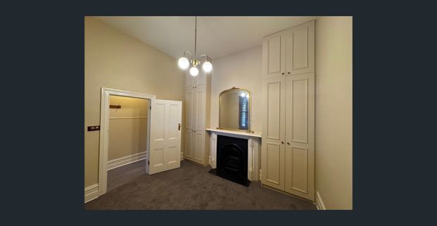 Renovated Victorian Charm with Courtyard and Off-Street Parking - Photo 1