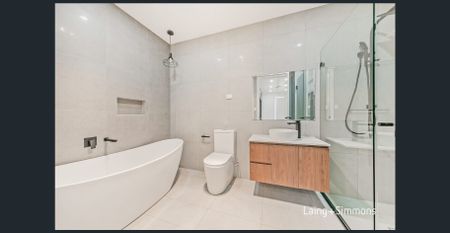 Stylish near-new four-bedroom home in a sought-after location - Photo 5