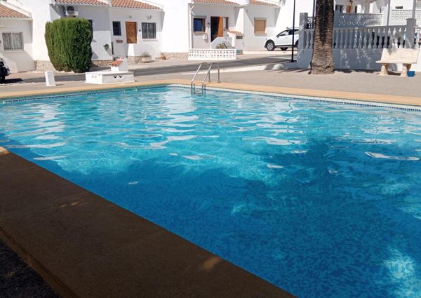 Beautiful two-bedroom townhouse with communal pool and parking – #AC-05483