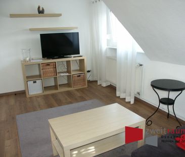 Wüste, modern möblierte Dachgeschosswohnung, fußnah zur City gelegen. - Photo 1