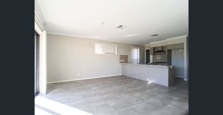 Modern 4-Bedroom Family Home in Sought-After Edmondson Park - Photo 2