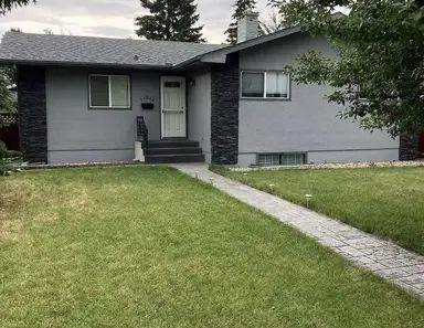 Newly renovated 3 BR fully furnished bungalow in Braeside SW | 11012 Braton Place SW, Calgary - Photo 1