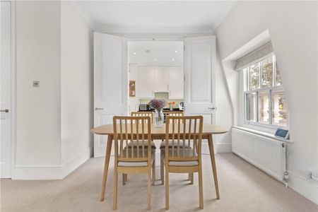 A fabulous, well presented and naturally bright three bedroom lateral apartment set on the third floor of this detached period villa on one of the most sought-after roads in Holland Park. Tenancy Length: Minimum 12 months EPC rating: C | Council Tax Band H - Photo 5