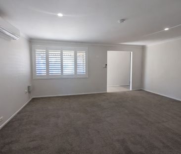 Spacious & Comfortable Family Home in a Convenient Gorokan Location - Photo 1