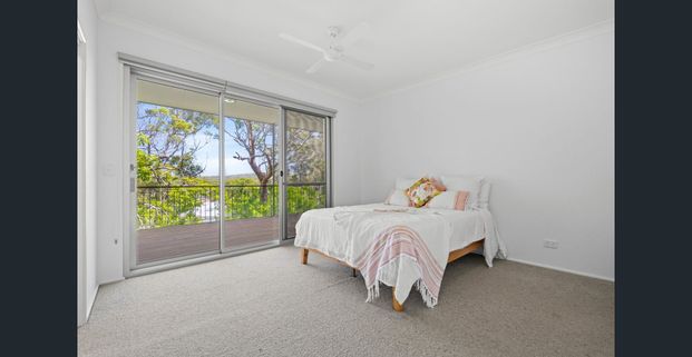 Elevated Three-Bedroom Home with Large Deck - Photo 1