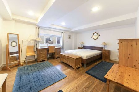 A charming two bedroom penthouse arranged over the second and third floors of this Victorian warehouse conversion located in the heart of Wapping. - Photo 3