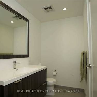 Feels brand new + den high ceilings parking included! - Photo 1