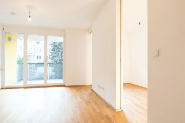 Balkonwohnung mit Blick in den grünen Innenhof im 21. Bezirk! - Photo 1