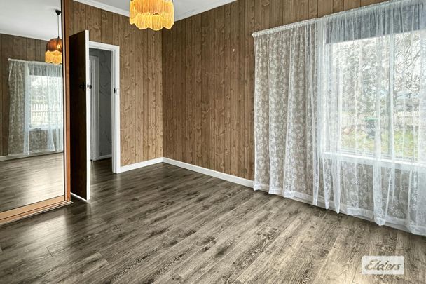 THREE-BEDROOM HOME WITH GARAGE - Photo 1