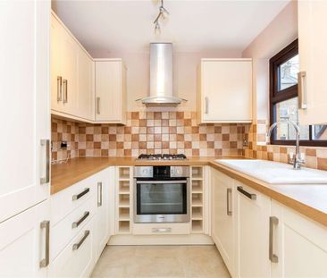 A two bedroom apartment within a small gated development just off H... - Photo 2