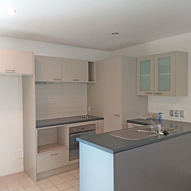 Townhouse Living in fully gated complex with 2 carparks - Photo 1