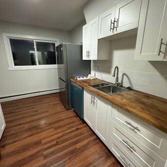 Spacious 2bd apartment with ALL utilities & assigned parking included - Photo 1