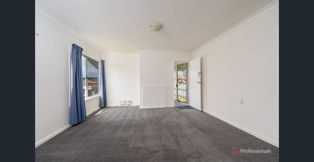 COMFORTABLE 4 BEDROOM HOME - Photo 1