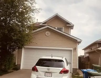 VERY COZY THREE BEDROOM MAINFLOOR IN MARTINDALE | Calgary - Photo 1