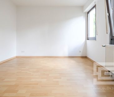 Traumhaft gelegene 2-Zimmer-Wohnung mit Terrasse und Garten in unmi... - Foto 1