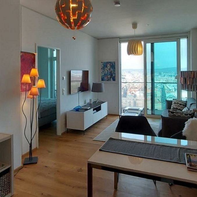 Herrlicher Blick über Wien! - Moderne, komplett eingerichtete 2-Zimmer Wohnung im Triiiple Tower mit großer Terrasse 9m² wartet! - Photo 1