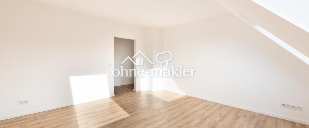 Sonnige Dachgeschosswohnung über dem Herzen der Stadt - Foto 1