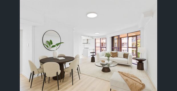 Stylish Renovated Apartment with Wrap-Around Balcony - Photo 1