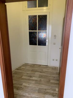 Straßenseitige Singlewohnung im Erdgeschoss - Foto 1