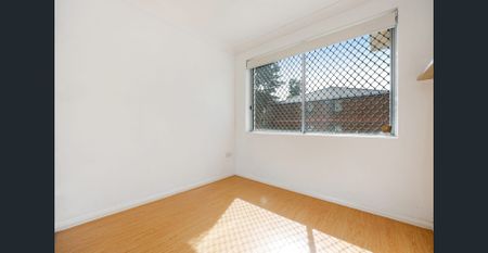 Bright and tidy two-bedroom brick unit with private balcony - Photo 2