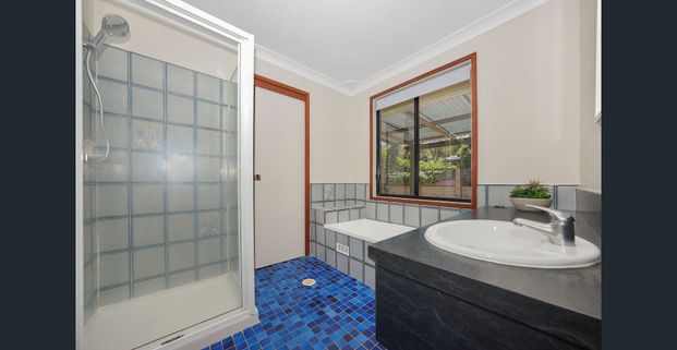 Perfectly positioned corner-block home in Eleebana with 3 beds, and spacious layout. Walk to schools, cafés, lake & more. Don't miss out! - Photo 1