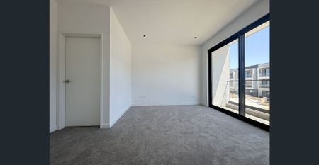 Spacious Three-Level Townhouse with Workshop & Dual Outdoor Living - Photo 3