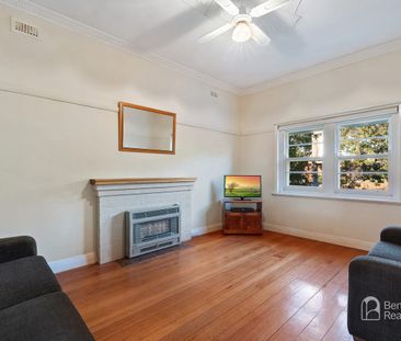 COMFORTABLE TWO-BEDROOM HOME WITH VERSATILE RUMPUS ROOM - Photo 2