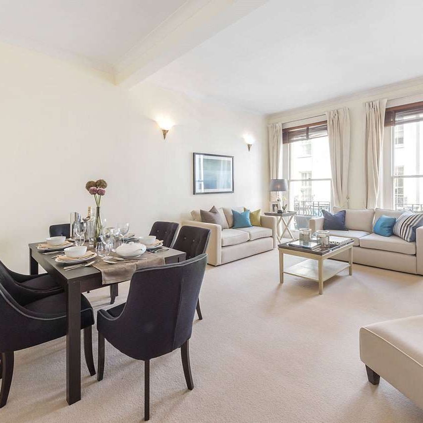 A bright two bedroom first floor apartment, boasting high ceilings and period features, situated in a handsome period building on sought after Motcomb Street. - Photo 1