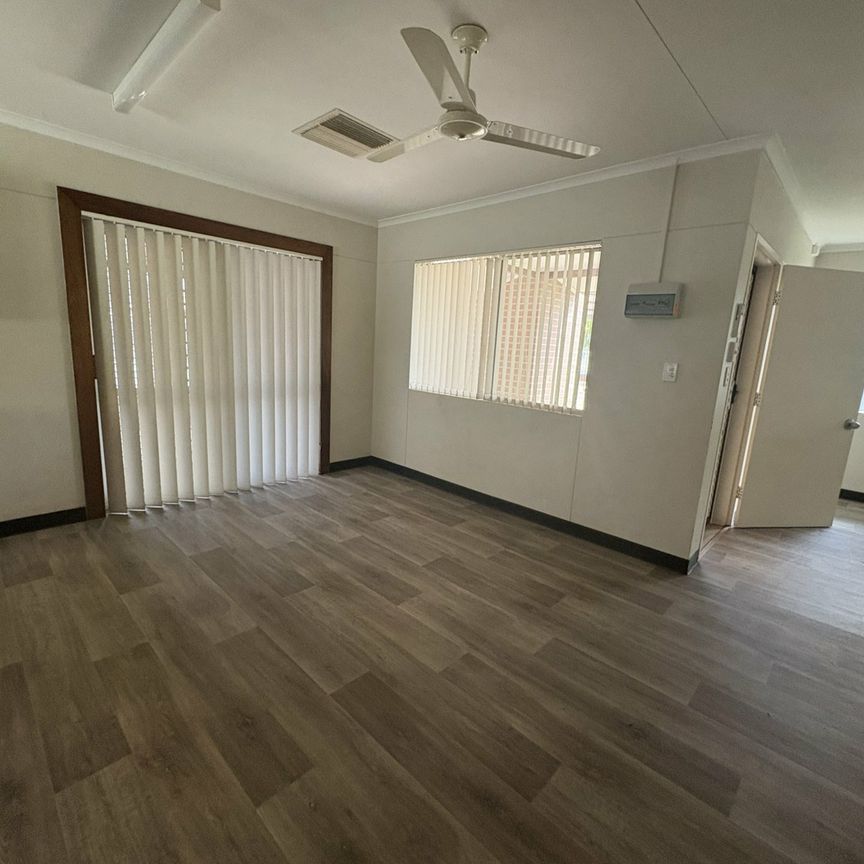 SPACIOUS FOUR BEDROOM, TWO BATHROOM HOUSE WITH 5X CARPORT - Photo 1