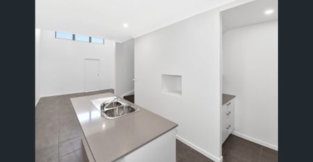 Modern 3-bedroom, 2-bathroom terrace home offering low-maintenance living in the heart of Baringa. - Photo 4