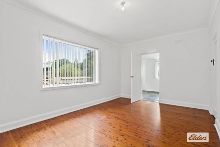 Neat & Tidy Family Home | Split-Level Living in Prime Location - Photo 5