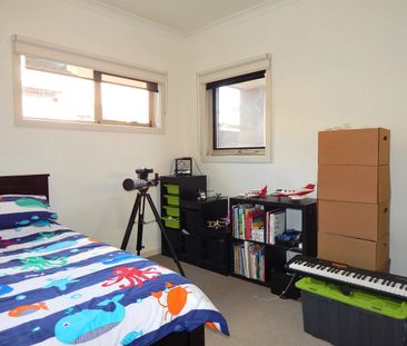 Stylish Three-Bedroom Home in a Convenient Reservoir Location - Photo 4
