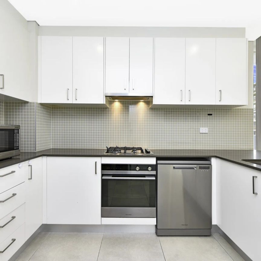 Top-Floor Penthouse with Dual Balconies | District Views - Photo 1