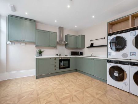 Step into stylish city living with this high-spec HMO in a stunningly repurposed pub—a perfect blend of character and modern comfort. Located in the heart of Derby City Centre (DE1), this beautifully converted property offers large studios and en-sui Room 5 - Photo 2