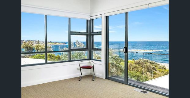 Furnished Coastal Oasis with Panoramic Views and Artistic Flair - Photo 1