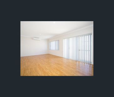 Coastal Comfort: Your Family Home Steps Away from the Beach! - Photo 1