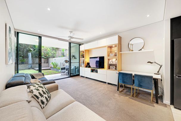 Oversized Ground Floor Garden Apartment with Enviable Backyard in Sought-After Complex - Photo 1