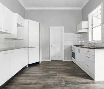 Character filled home on a level sunny block - Photo 2