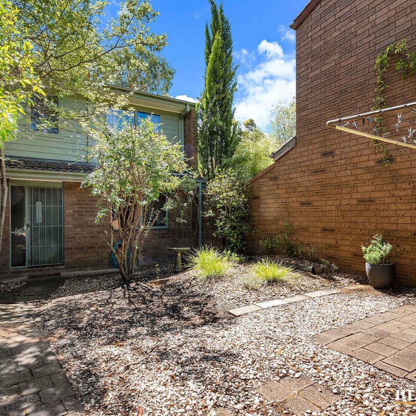 Charming Townhouse with Renovated Appeal and Original Charm - Photo 1