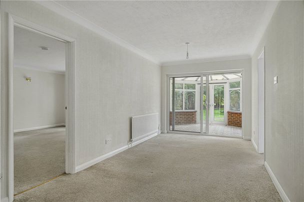 A 3 bedroom detached bungalow with a double garage and ample parking. - Photo 1