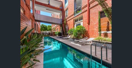 Top-Floor Loft Living with Timeless Industrial Charm - Photo 3