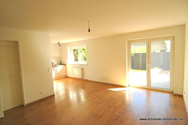 Schicke 2-Zimmer-Erdgeschoss-Wohnung mit Terrasse und Gartenanteil - Photo 1