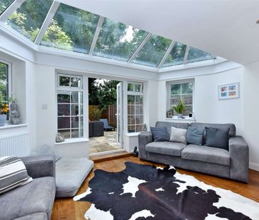 A well presented four bedroom townhouse situated in the heart of Cobham Town centre. - Photo 1