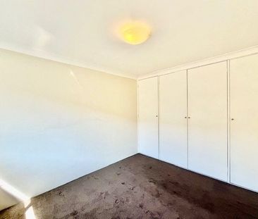 Beautifully Renovated Two-Bedroom Unit! - Photo 1